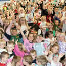 Children partying away at their schools' 50th birthday.