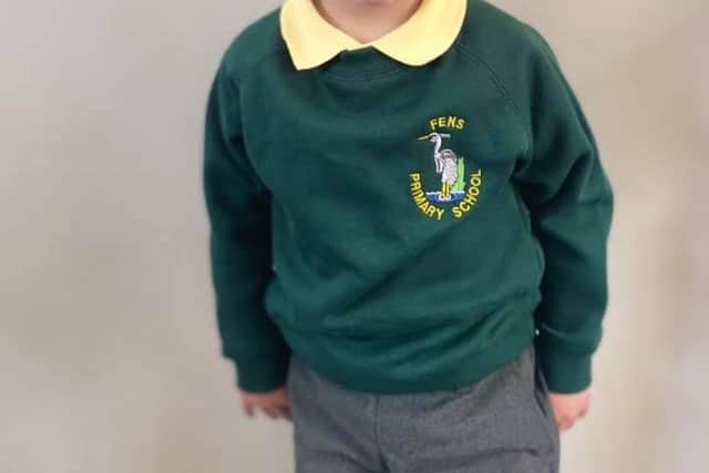 A proud moment for all the family as Noah has his photo taken in his school uniform.