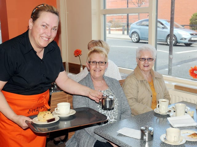 Eugene's cafe manageress Lisa Jacobs serving customers Trish Rayne and Syheila Butcher soon after it opened in 2013.