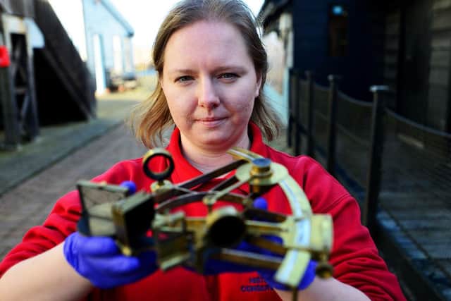 Conservation Technician Emma Callaghan with a sextant she has cleaned. Picture by FRANK REID