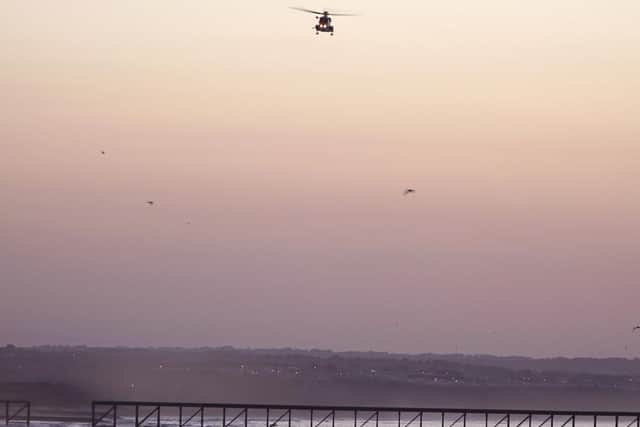 Thursday night's helicopter search over Steetley Pier. Picture by Steve Lord.