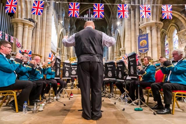 Oddfellows Brass playing at St Hilda's Church, on the Headland, in 2019.