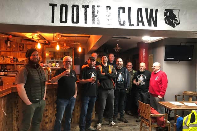 Fishermans Arms regulars and Tooth and Claw staff pictured after their brewing session.