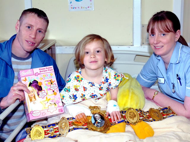 Hartlepool boxer Michael Hunter gave out Easter Eggs to children staying at Hartlepool General Hospital in 2006.