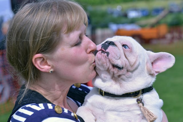 French Bull dog Barley gets a well deserved kiss from owner Caroline Craven during the Dogs Day Out event at Summerhill 8 years ago.