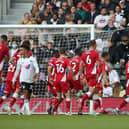 Middlesbrough players celebrate Marc Bola's goal at Fulham.