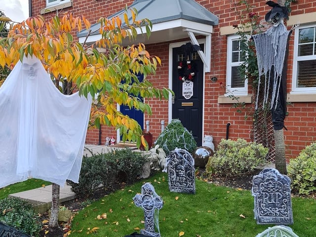A ghost keeps guard outside the front door of this home. It's his gaff!