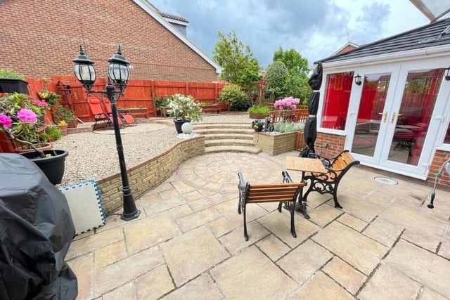 The rear garden is ideal for entertaining guests in the summer.