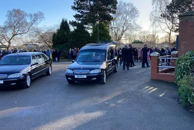 Nicola's coffin is carried into the chapel.