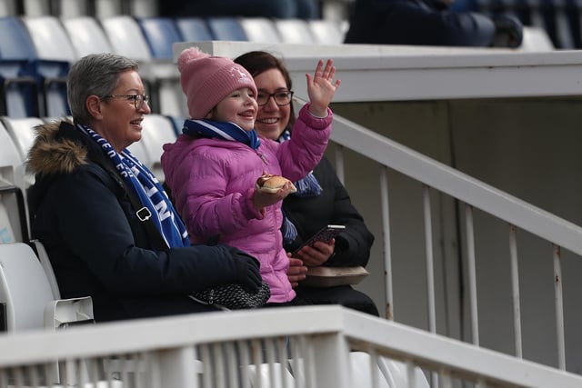 Girls enjoy a day out at the match.