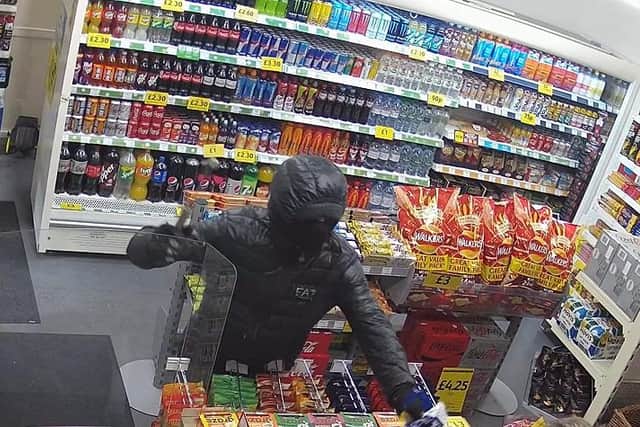 An image of the attempted robbery at the Jet garage from CCTV of the incident.