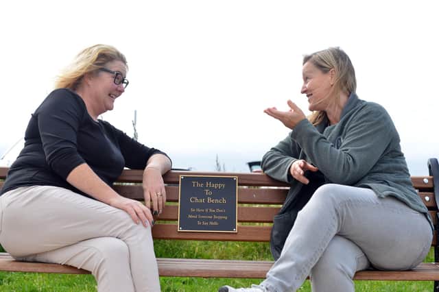Cllr Sue Little and Cllr Leisa Smith (on the right) enjoy a conversation on a Happy To Chat Bench.