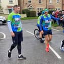 Kevin Sinfield, wearing a head band, and his running team arrive at Wynyard on Wednesday at the halfway point in his 7-in-7 charity challenge.  Picture by FRANK REIDâ€™