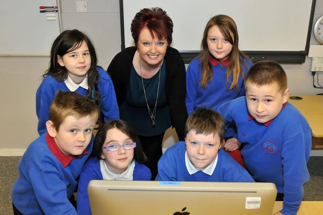 Throston Primary School IT co-ordinator, Linda Crowe, alognside Chelsea Baldwin, Poppy Cummings, Charlie Banks, Caitlin Joblings, Josh Simpson and Rhys Din, in 2013.