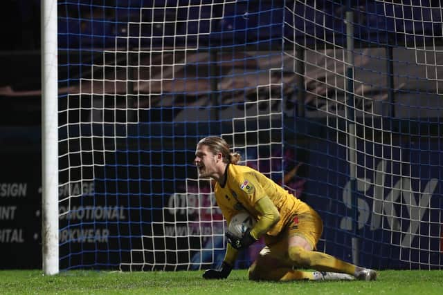 Ben Killip of Hartlepool United saves Josh Kelly's penalty during the shoot out to decide the FA Cup first round replay between Hartlepool United and Solihull Moors. (Credit: Mark Fletcher | MI News)