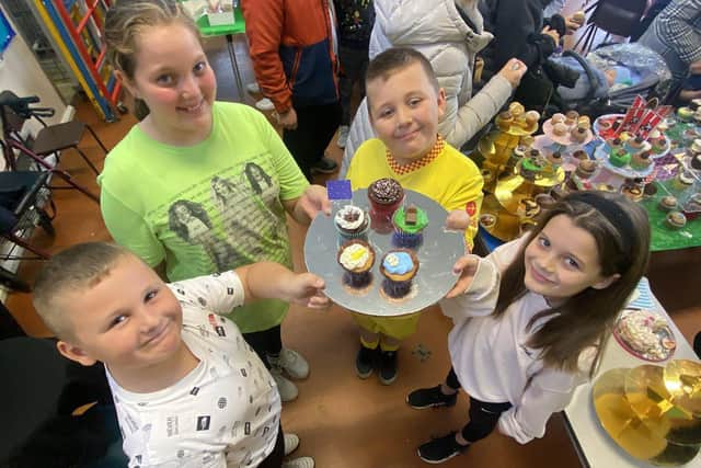 Pupils (left to right) Jake, Scarlette, Jackson and Isla with a selection of cakes at the coffee afternoon.
