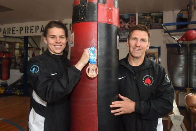 Savannah Marshall with Headland Amateur Boxing Club coach Tim Coulter.