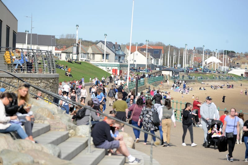 People head out to Seaburn beach as the sun gets his hat on.
