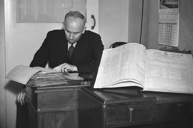 Hartlepool jeweller Harry Lamb is pictured studying a meteorological register back in July 1954.