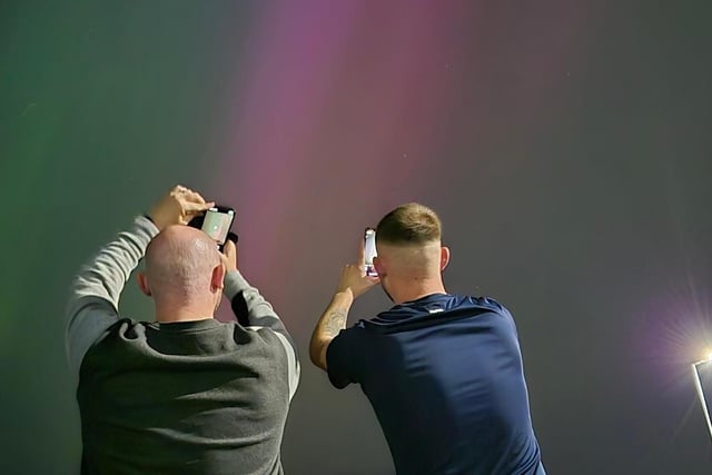 Hayley Wood sent us this picture of Sean and Adam taking pictures of the lights at the Headland.