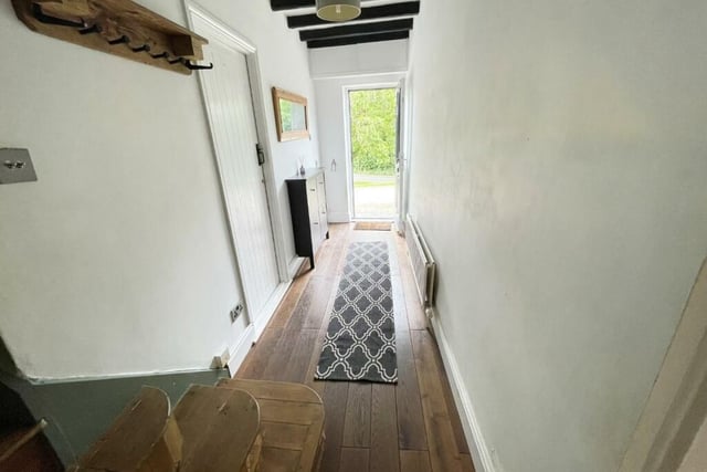 The entrance hall is fitted with dark oak flooring and has integral door to the garage.