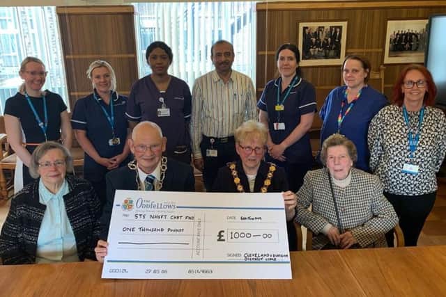 Members of Hartlepool's The Oddfellows branch present the Sunderland Eye Infirmary with a cheque for £1000.