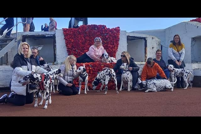 Dalmatian owners pose for a picture with their pooches at the Heugh Battery Museum.