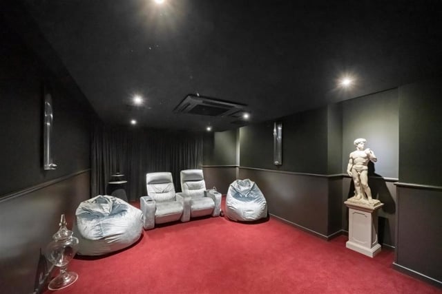 The cinema room on the basement level is one of the highlights of the home.
