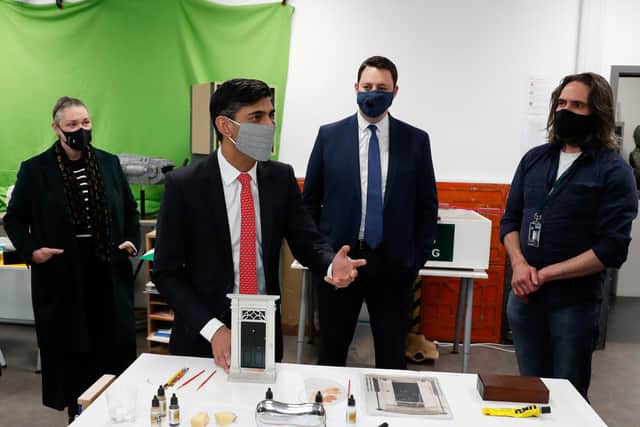 Chancellor of the Exchequer Rishi Sunak wears a mask as he talks to people during a local election campaign visit to the Northern School of Art in Hartlepool. He was joined by Hartlepool Conservative by-election candidate Jill Mortimer (left) and Tees Valley Mayoral candidate Ben Houchen.