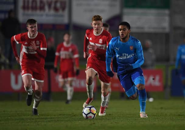 Trae Coyle of Arsenal takes on Connor Malley of Middlesbrough.