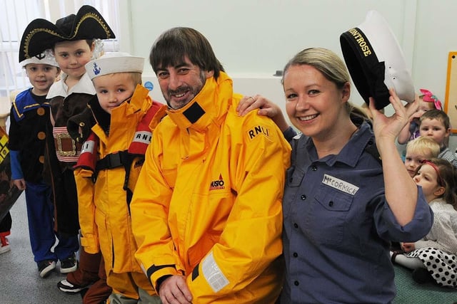 Throston primary school staff member Diane Mc Cormick gets her photo taken alongside Hartlepool RNLI crew member Peter Marriage and pupils during the RNLI SOS fundraising day at the school in 2011.