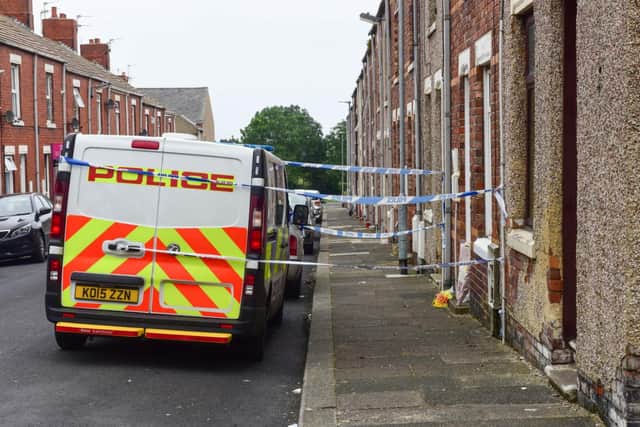 Police cordoned off John Littlewood's home as investigations began into his death in July 2019.