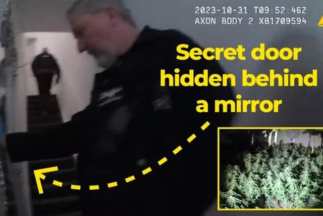 A Durham Police image of officers discovering the secret door to a cannabis farm.