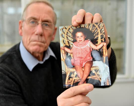 Richie Lee at home in Hartlepool with a photograph of Katrice Lee aged 18 months.
