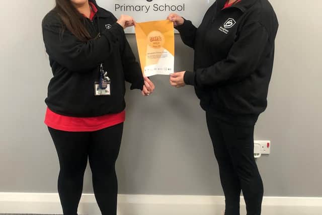 Keighley Bradford, left, and Jenn Hopkins with the School Games Gold Award certificate.