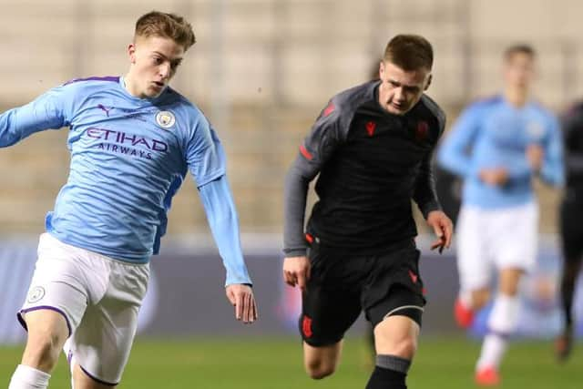 Liam Delap of Manchester City beats Eddie Jones of Stoke City during the Premier League Cup Final between Manchester City and Stoke City at The Academy Stadium on March 10, 2020 in Manchester, England. (Photo by Alex Livesey/Getty Images)