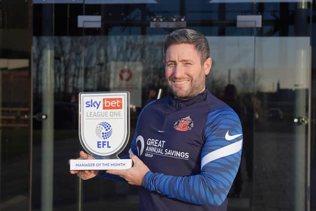 Lee Johnson with his award.
