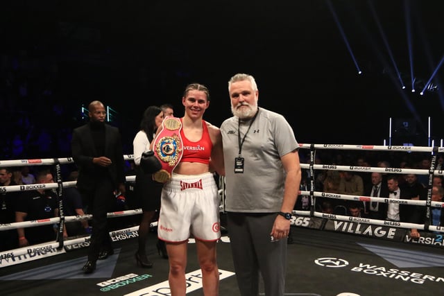 Savannah Marshall and her trainer Peter Fury pose in celebration after Marshall defended her WBO middleweight title in Newcastle. Picture by Martin Swinney