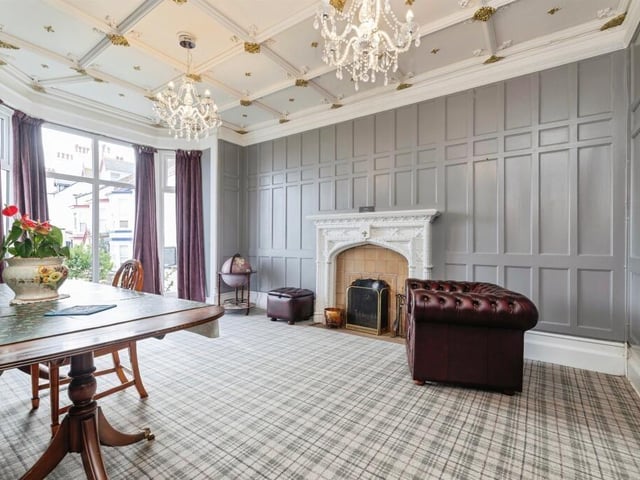 This room has a cast iron radiator and open fire with marble hearth.