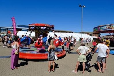 Parents watch on as children enjoy a ride at the Waterfront Festival. Picture: Carl Gorse.