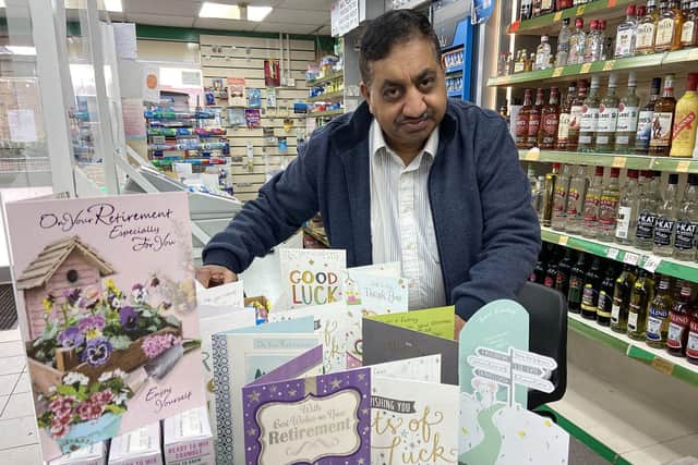 Mohammed Sawar, of Cashcare in Owton Manor Lane, with a selection of retirement cards he received from customers. Picture by FRANK REID