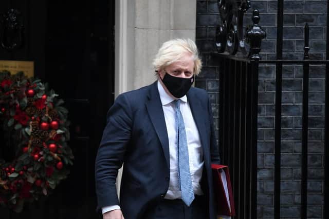 Prime Minister Boris Johnson leaves Downing Street to attend Prime Minister's Questions on December 8. Picture: Chris J Ratcliffe/Getty Images.
