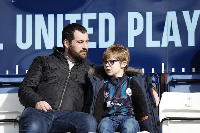 A father and son in the stands at the Suit Direct Stadium. Photo: Mark Fletcher