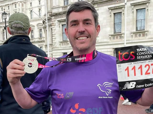 Lee Dodgson with his medal after completing the London Marathon.