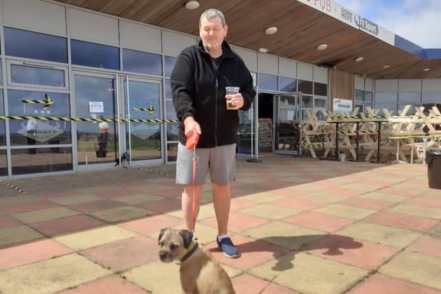 Craig Arnott, seen here with his dog Myles, said: "t’s a little bit of normality again.”