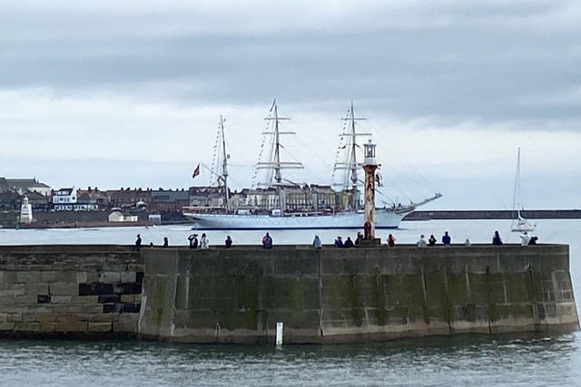 Onlookers on the Headland watch the tall ships depart on Sunday morning. Picture by FRANK REID