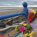 Flowers on the seafront at Seaton Carew after a swimmer died there at the weekend.