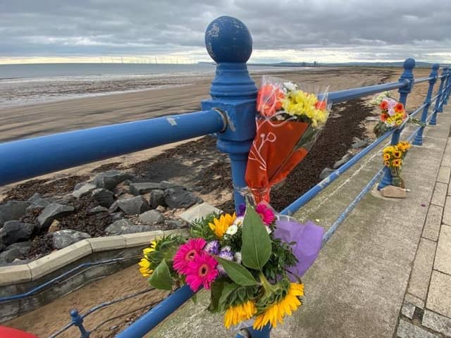 Flowers on the seafront at Seaton Carew after a swimmer died there at the weekend.