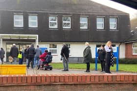 Queues of people outside Victoria Medical Centre on Wednesday morning.