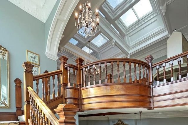 The impressive mahogany staircase leads to the first floor of the home.